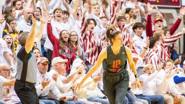 Indiana's Yarden Garzon (12) celebrates her made three-pointer over Iowa's Kate Martin (20) during the first half of the Indiana versus Iowa women's basketball game at Simon Skjodt Assembly Hall on Thursday, Feb. 22, 2024.